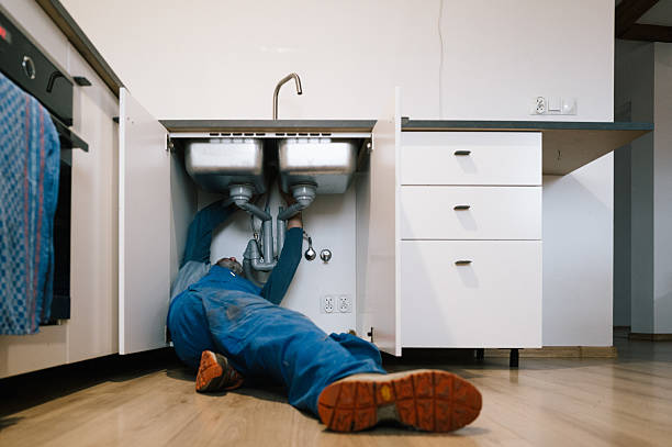 Professional Drain Cleaning technician working in Rice, WA